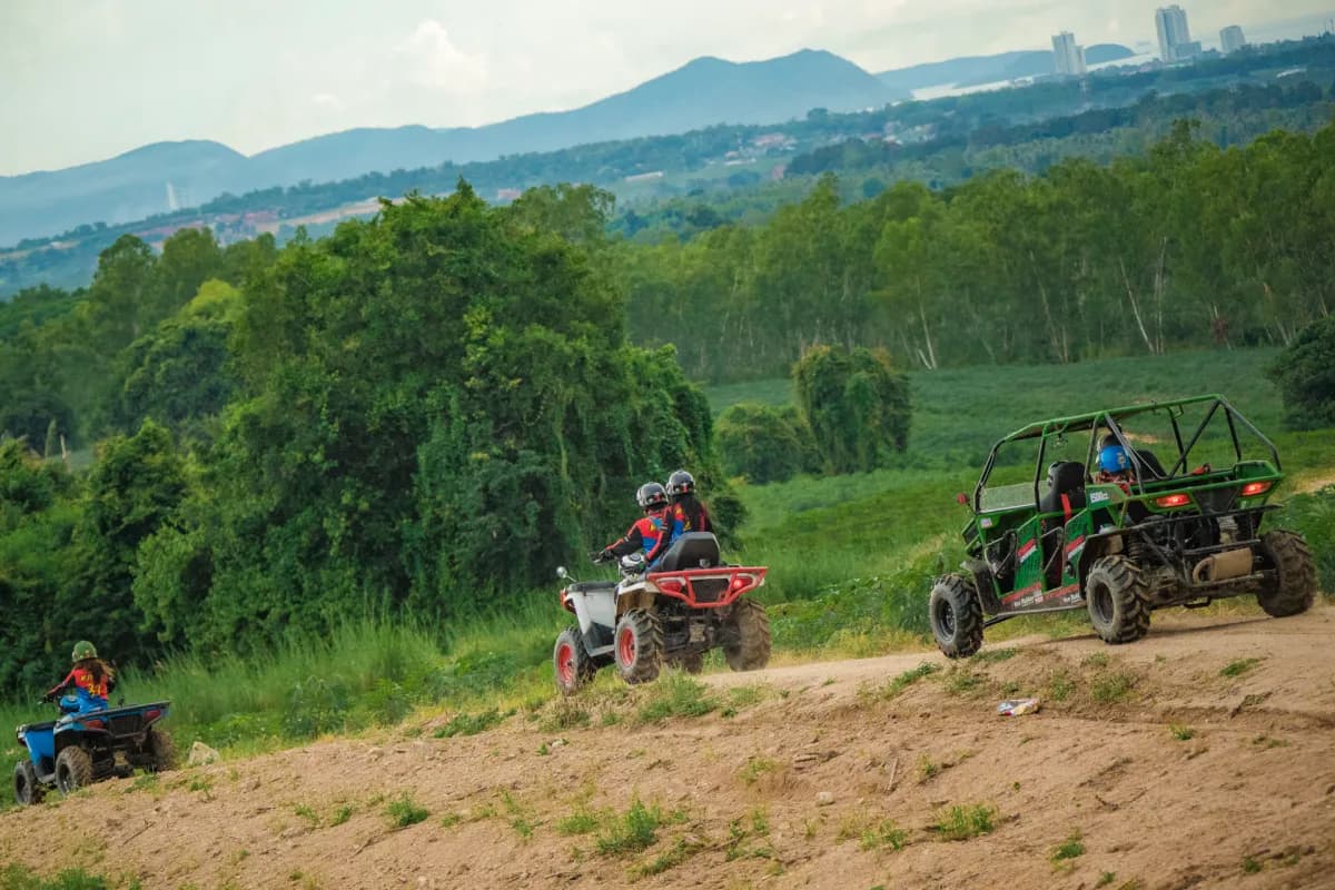 Adventure Tour group riding on hillside with mountain views